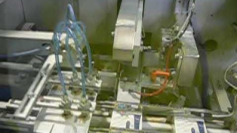 Paxon Packaging automated line of cosmetics multiple bottles into carton packing