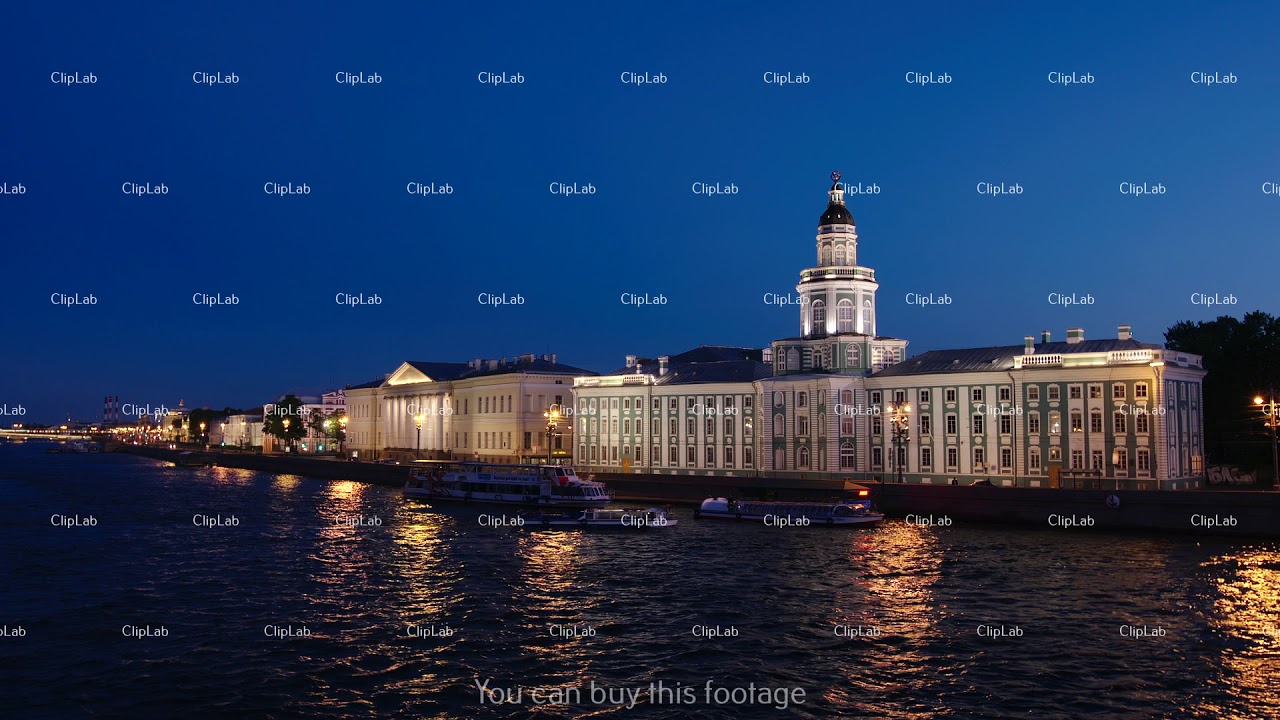 ST. PETERSBURG: Tour boat on the Neva river near the Kunstkamera building in the White nights