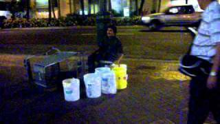 Street Performer Drumming In Oahu