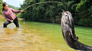 Traditional fishing technique – A young woman has caught a large haul of carp and catfish.
