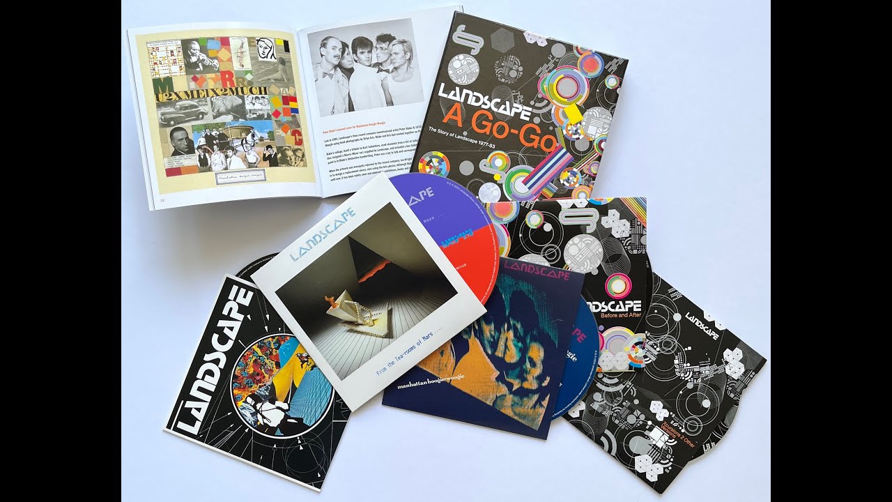 Description: John demonstrates the contents of the box set while Andy’s instrumental mix of ‘Manhattan Boogie-Woogie’ plays in the background.