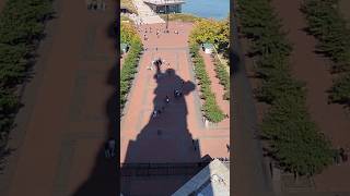 Panaromic view of Liberty isle, complete with Statue of Liberty's shadow, Manhattan skyline, NY, US.