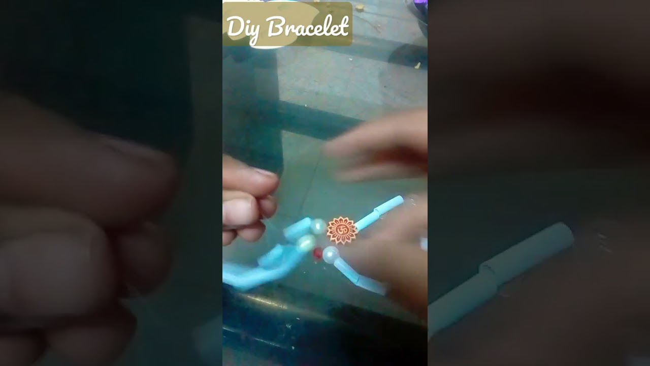 Diy Om Bracelet                  things needed--om shaped beads,beads,theard.