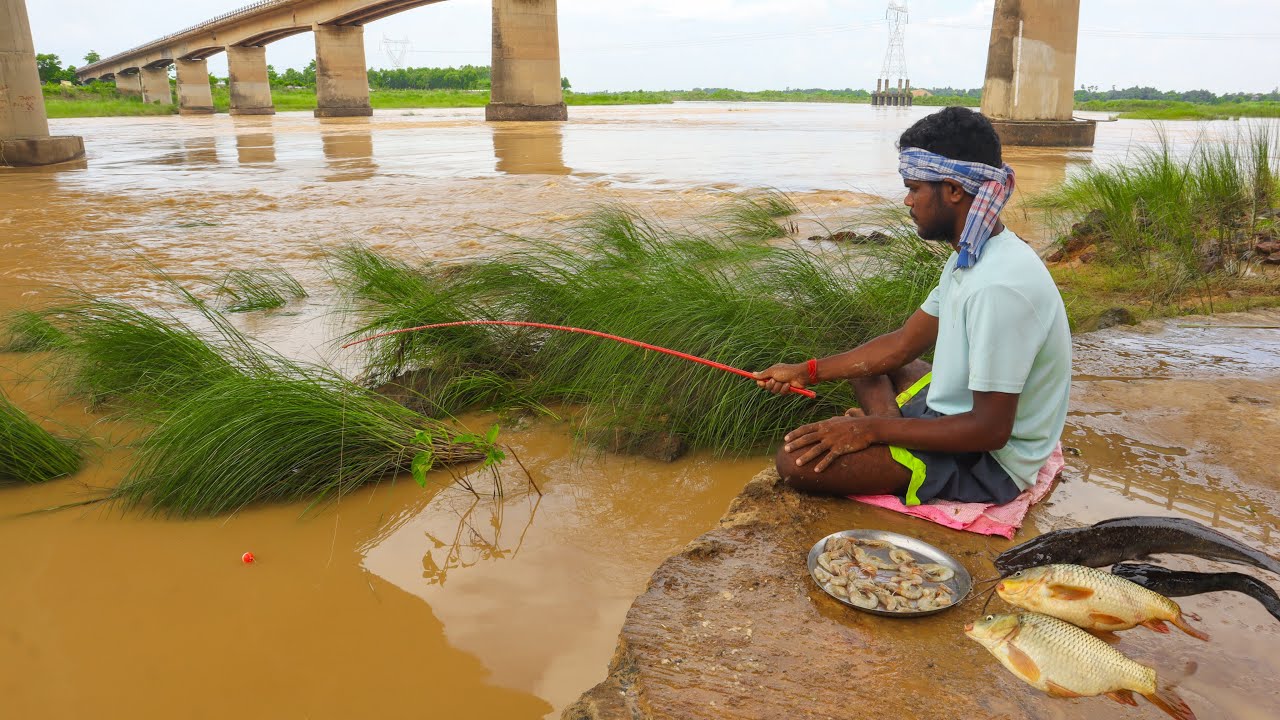 Fishing video || Traditional boy catches fish in the river in an incredible way in the choppy water