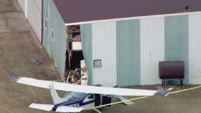 Plane crashes into hangar at suburban airport
