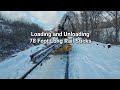 Hauling 78 foot sticks of rail in the snow