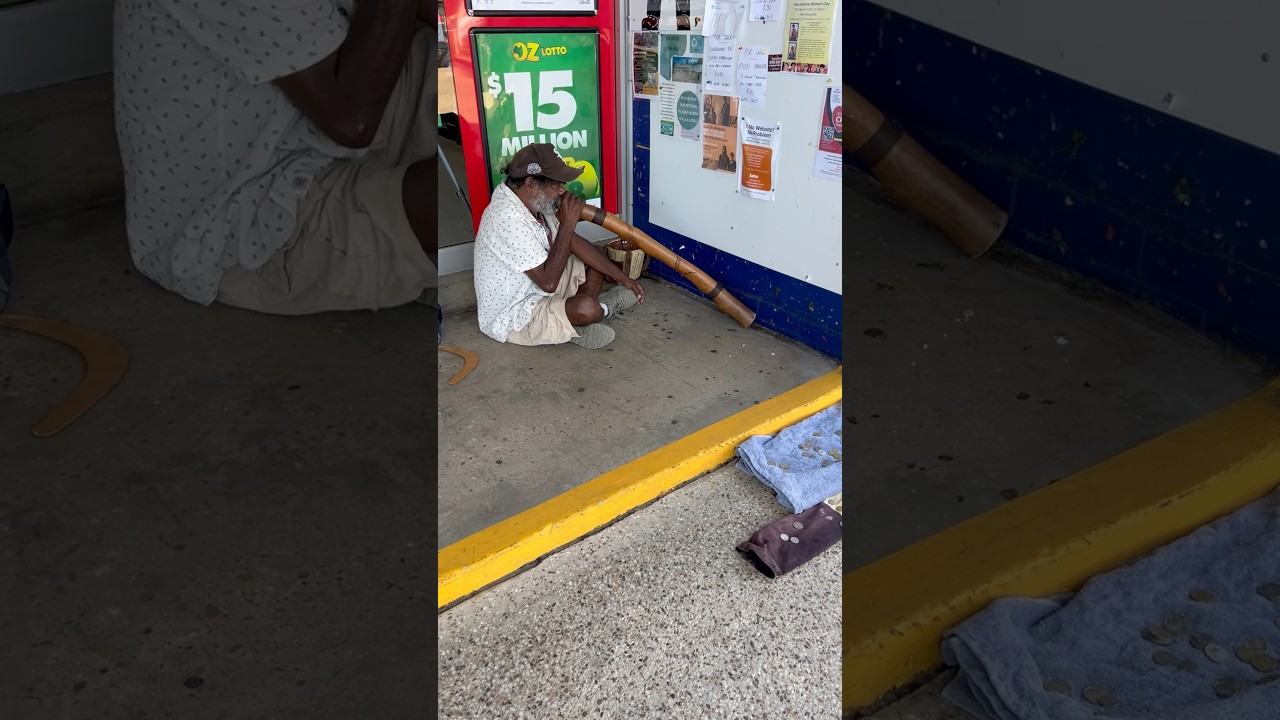 Aboriginal man playing his instrument 