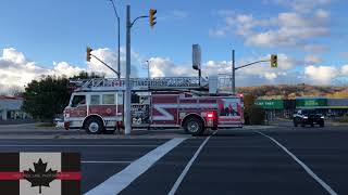 Multiple Fire Trucks Responding To A Large Commercial Fire