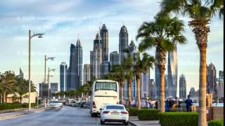 Waterfront promenade on the Palm Jumeirah with palms at road timelapse. Dubai, United Arab Emirates