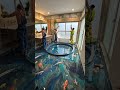 Luxury washroom with a stunning blue pool metallic epoxy floor illusion  #epoxyfloor #viral