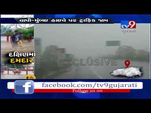 Heavy rain leaves Vapi-Mumbai road waterlogged, hour-long traffic jam | Tv9GujaratiNews