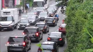 Police motorcycle escort a convoy of diplomats in Paris.