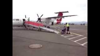 Wheelchair passenger on DASH-8 boarding ramp