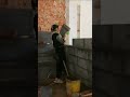 the process of installing large bricks to create a room dividing wall in a building #construction