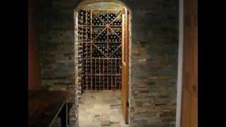 Custom built wine cellar by Cedar Line Contracting. Cedar Line Contracting converted this hallway and cold cellar into a Wine 