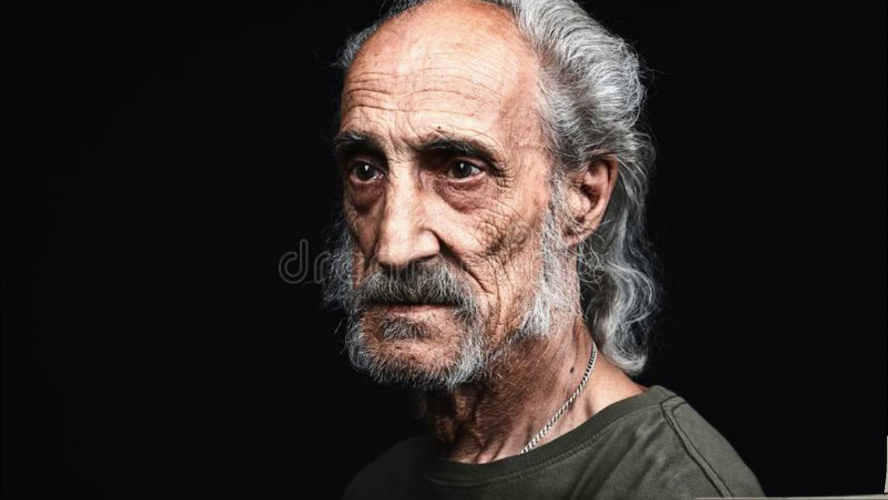 Tired old man. Old man face profile Black background. Waiting face