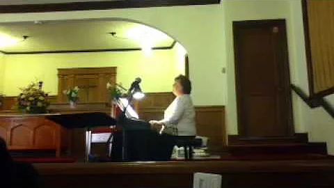 Paula Handley playing  piano at church