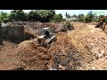 The best job site activities bulldozer pushing rocks stone recovery canal  dump truck dumping rocks