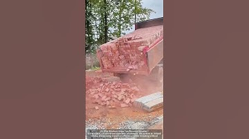 Trucks loaded with bricks are unloaded with a hydraulic system