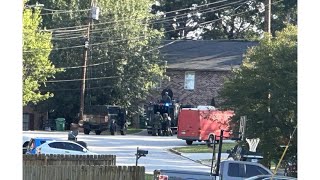 Man shot by police in Lithonia neighborhood following hostage situation, department says