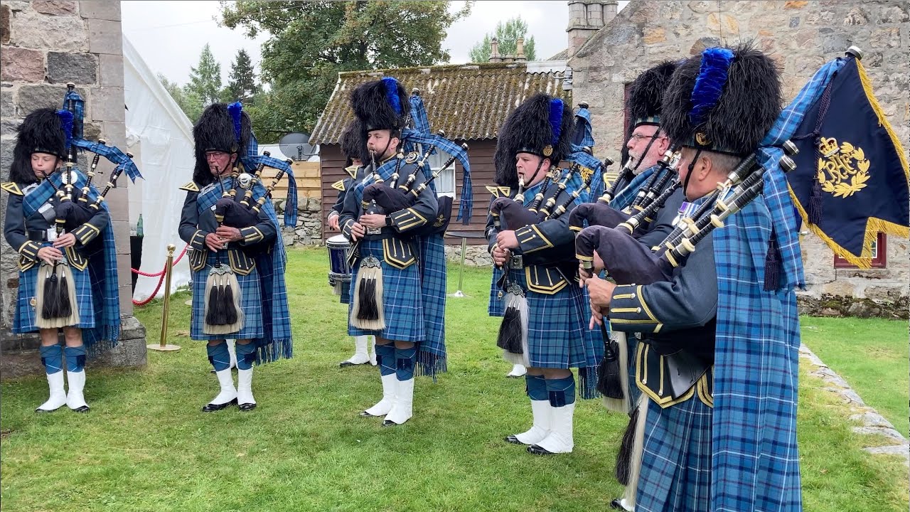 RAF Central Scotland Pipes and Drums playing outside St Margarets in