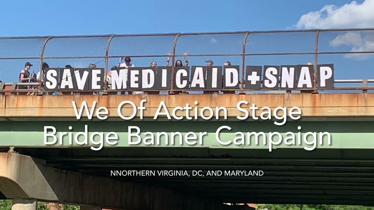 Mass Bridge Banner Drop To Mock Trump’s War March Party