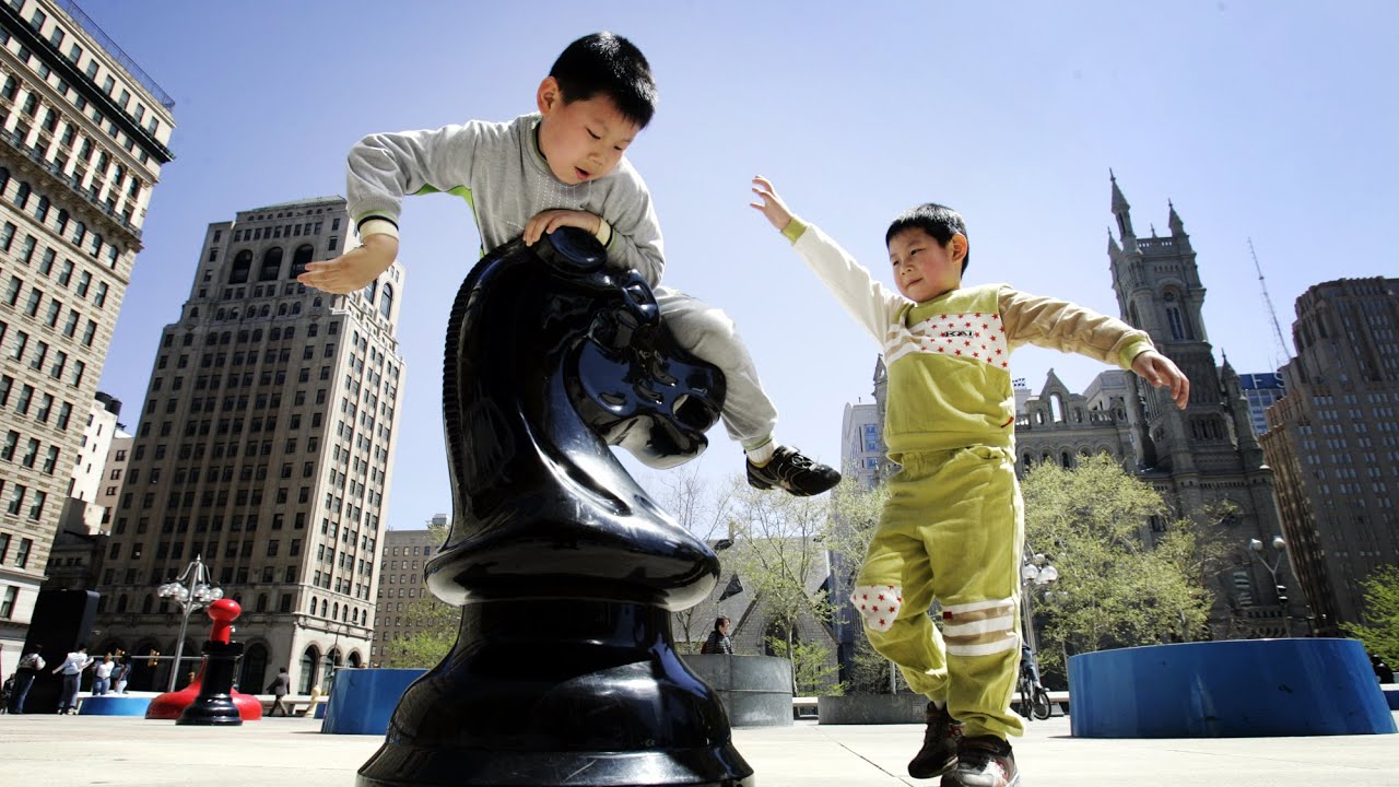 Game Over: Landmark Center City Philadelphia art installation of oversized game pieces being removed