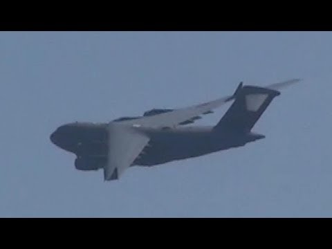 Boeing C-17 appears over peaceful valley in Germany