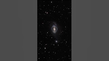 Zoom into the galaxies NGC 1512 and NGC 1510 in 4K