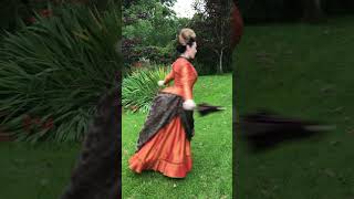 Getting dressed in an autumnal bustle gown