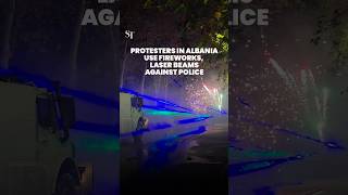 Protesters in Albania use fireworks and laser beams against police