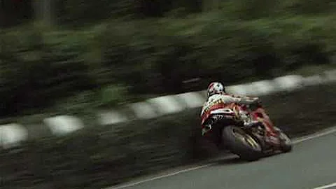 Robert Holden brushes the wall at the 1995 Senior TT