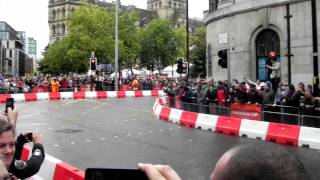 Jenson button speeds through manchester in f1 mclaren