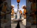 Installing a giant bridge section hundreds of meters above a canyon