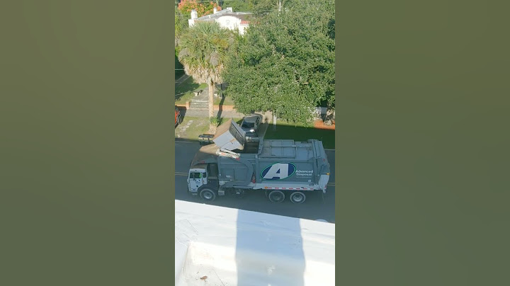 trash truck dumpster dump from rooftop .
