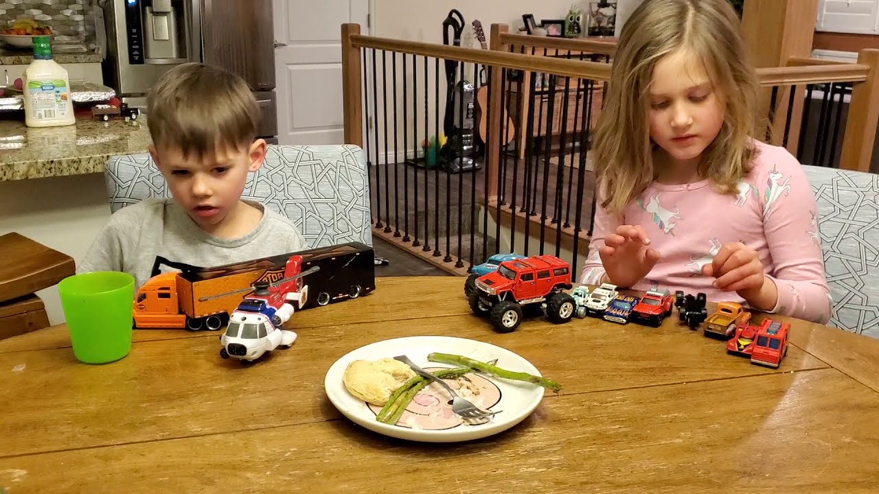 Playing with toys at the dinner table - YouTube