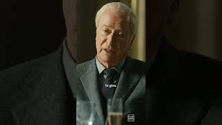 When you see the pictures in Sir Michael Caine’s apartment, you also see a framed Batman logo,