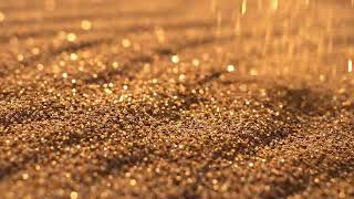 Close-up macro shot of desert sand being gently blown by wind