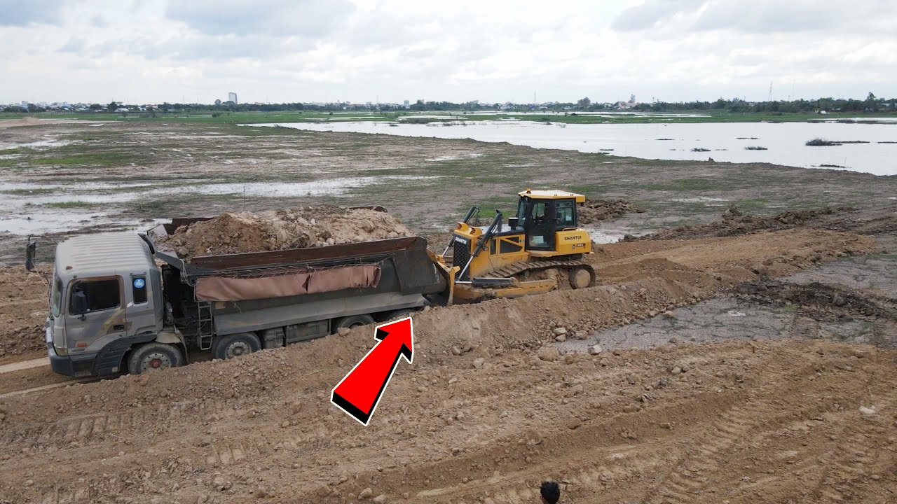Strongly SHANTUI Dozer Pushing Soils and Saved Dump Trucks 25 t stuck during dumping rock