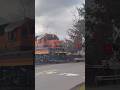Conductor flags crossing while gates are down! SW McEwan Rd. #freighttrain #railroadcrossing #shorts thumbnail