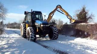 McConnel Econ New Holland TM125 mid-mounted hedge cutting