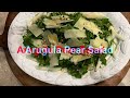 Easy and tasty arugula pear salad with pine nuts
