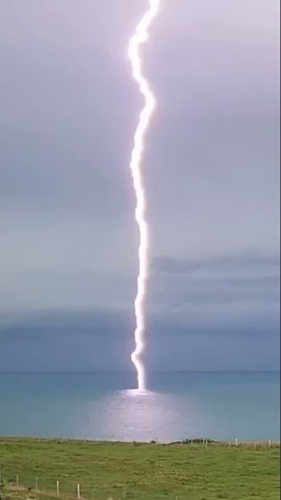 Rare footage shows moment lightning bolt slams into the sea off the English coast | SWNS