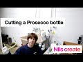 Cutting a Prosecco bottle
