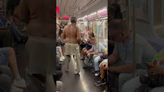 Shirtless homeless man w ripped pants steals food from woman sitting on train then runs through door