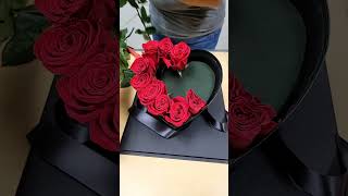 An Acrylic Pink Heart Box Flower Arrangement