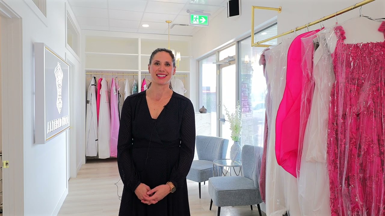 Ross Contracting commercial contractor Red Deer interior build for Altered Gown bridal alterations boutique featuring open white space and gold accents
