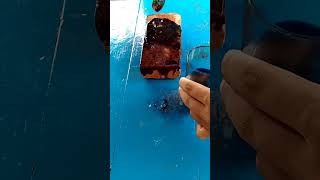 An orange stone, a fire in blue water