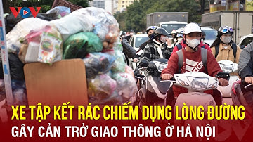 Xe tập kết rác chiếm dụng lòng đường gây cản trở giao thông ở Hà Nội | VOV