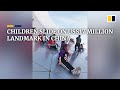 Children slide on US$17 million landmark in China